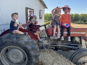 a bunch of kids on tractor