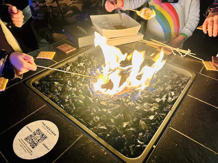 fire with people making s'mores