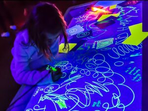 child painting with light phosphorescent