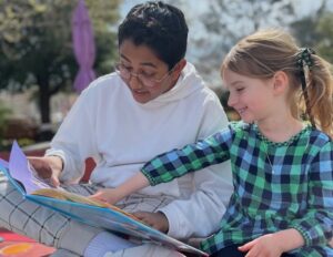 two children reading 8th grade & kindergarten reading buddies. Courtesy of Park Day School