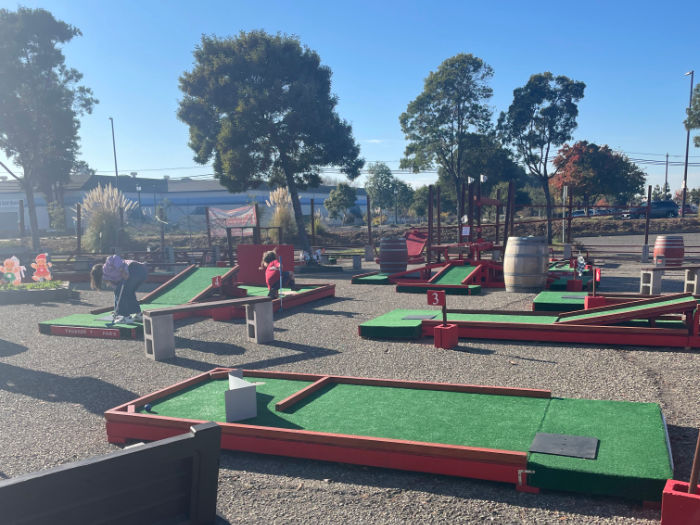 overlooking several holes of an outdoor custom putt putt course