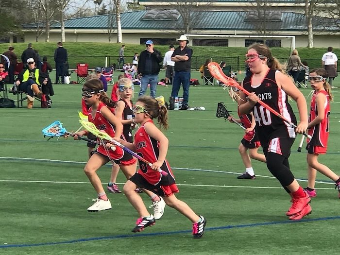 girls playing lacrosse