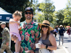 Mother father and daughter at outdoor music event