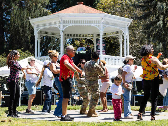 Crowd dancing outside at music festival