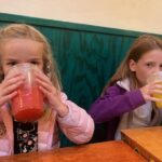 Children drinking Aguas Frescas