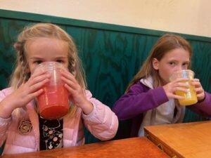 Children drinking Aguas Frescas