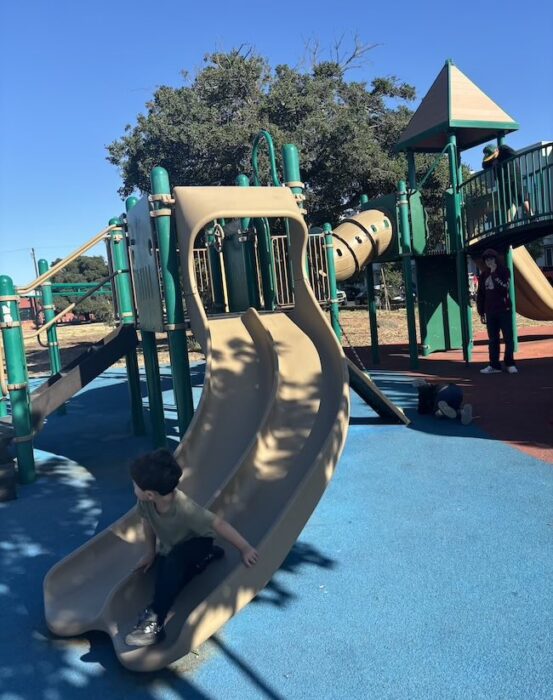 Raimondi playground in Oakland slide and kid