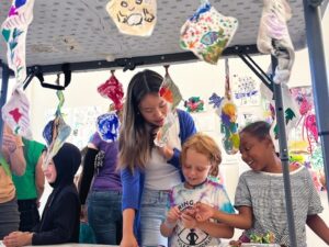 Students admire each other's work at the art showcase