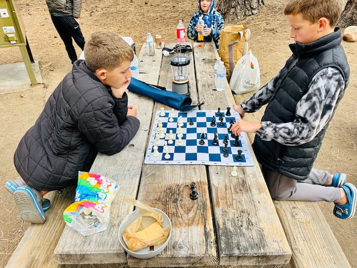 two kids playing chess