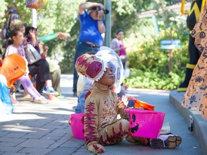 costumed children watching performers at fairyland halloween