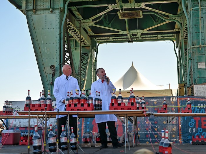 Maker Faire Bay Area Diet Coke Mentos experiment run by 2 scientists outdoors