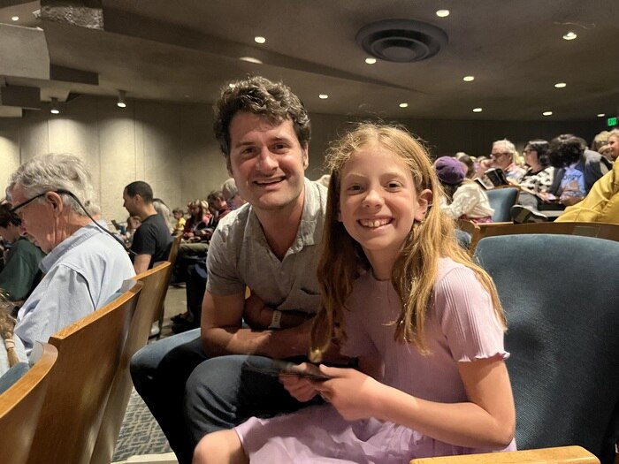 Father and daughter attending performance at Zellerbach Hall