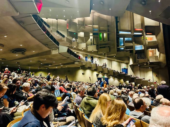 crowd sitting in a theater