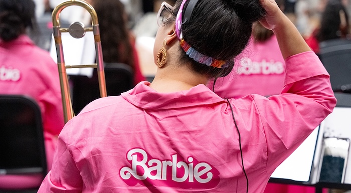 musicians wearing barbie pink jackets while playing instruments