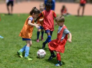 little kids playing soccer