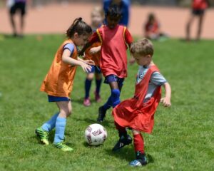 little kids playing soccer