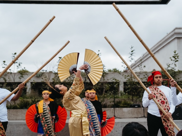 lunar new year chinese fan performers in the omca garden