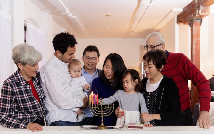 Family lighting menorah