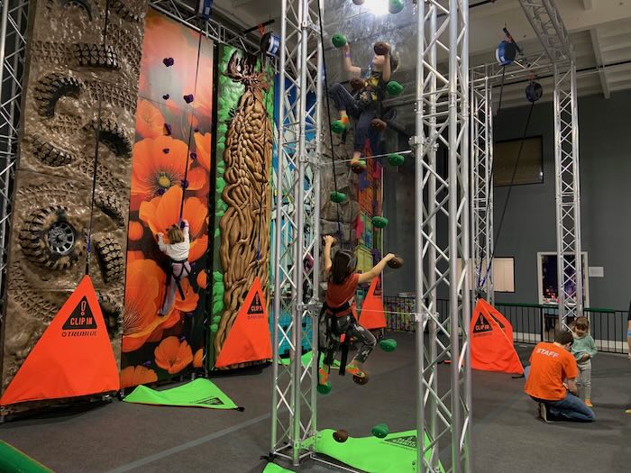 painted walls behind climbing apparatus handholds children climbing at bay play oakland
