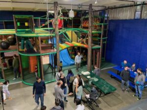 large indoor playground with children and parents at bay play oakalnd