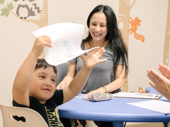 East Bay Child Development Center adult and child at a table