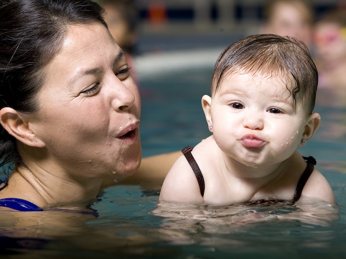 adult and baby in a swimming pool