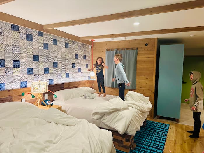 kids jumping on a bed