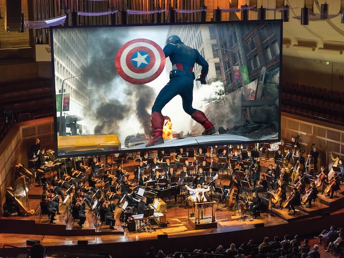 captain america on the big screen with full orchestra