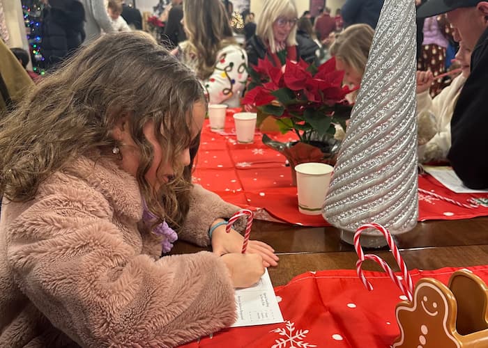 girl writing a letter to santa