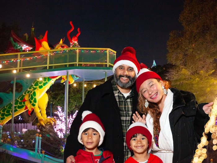 family at fairy winterland fairyland in santa hats