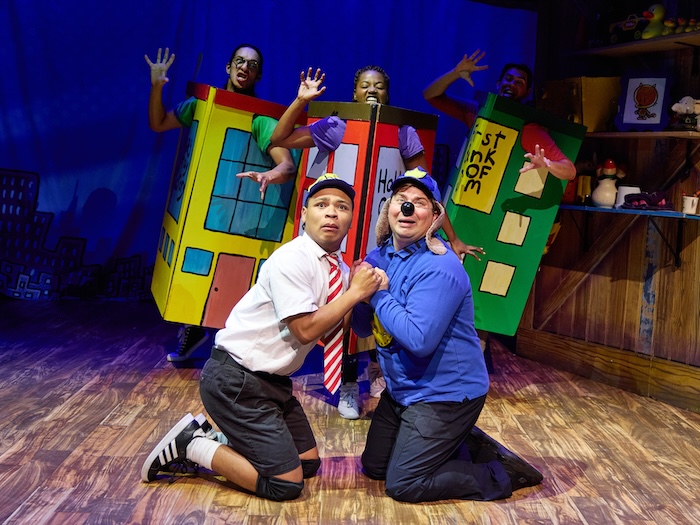 dog man musical with 5 people in costumes including 3 dressed as angry buildings