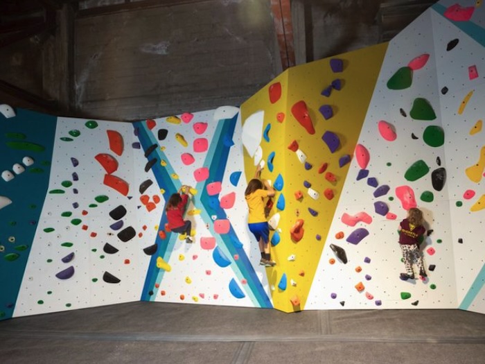 kids climbing on the kids climbing wall