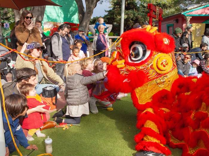 lion dance at fairyland performed by Cal VSA Lion Dance - children greet the performer