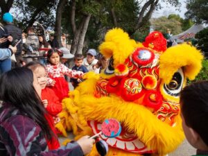 lion dance at fairyland performed by Cal VSA Lion Dance children greet the performer