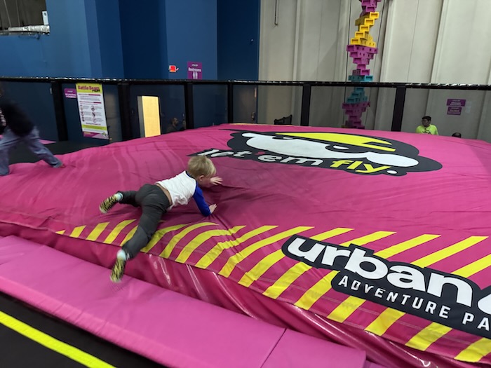 toddler on the giant air pillow at urban air