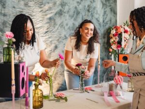 women creating a bouquet at a flower bar