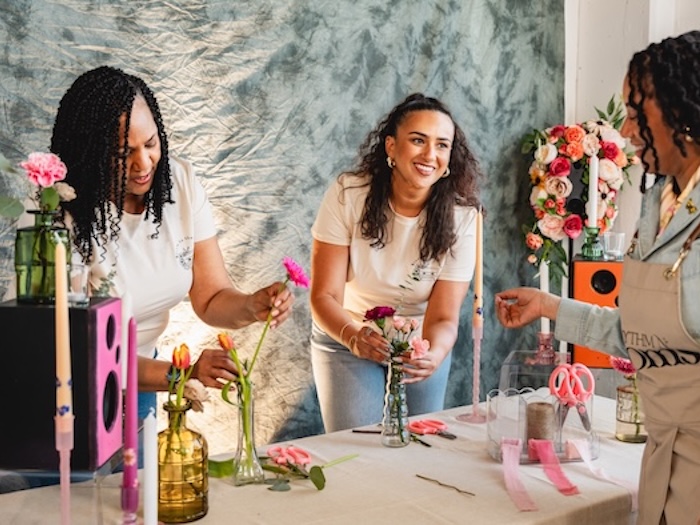 women creating a bouquet at a flower bar