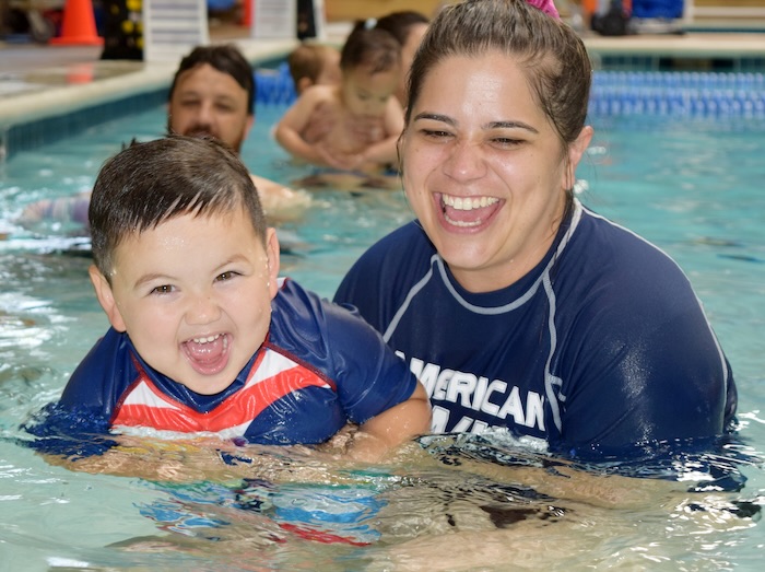 adult and toddler in the swimming pool