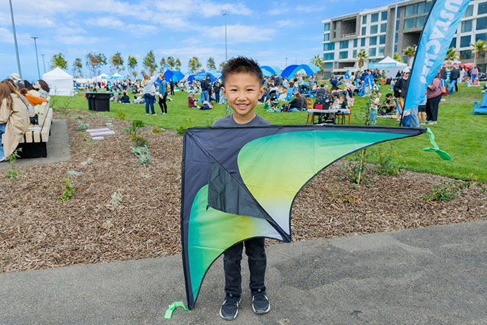 Treasure Island Cityside Park child holding a kite