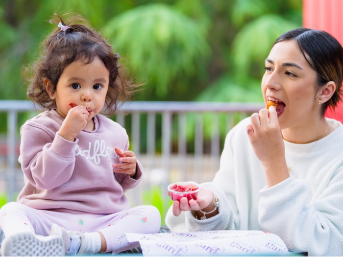 adult and child eating cherry related foods and being cute