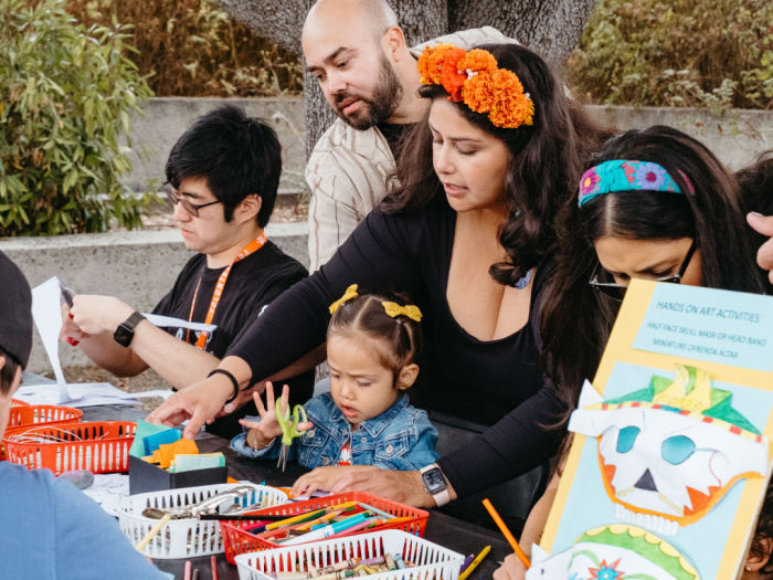 many ages of people using craft supplies to make art