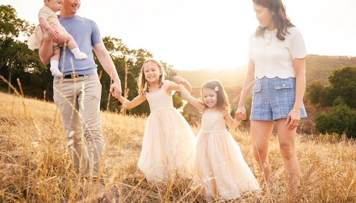 family in a sunlit field