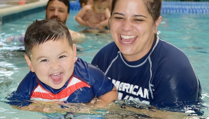 adult and toddler in the swimming pool
