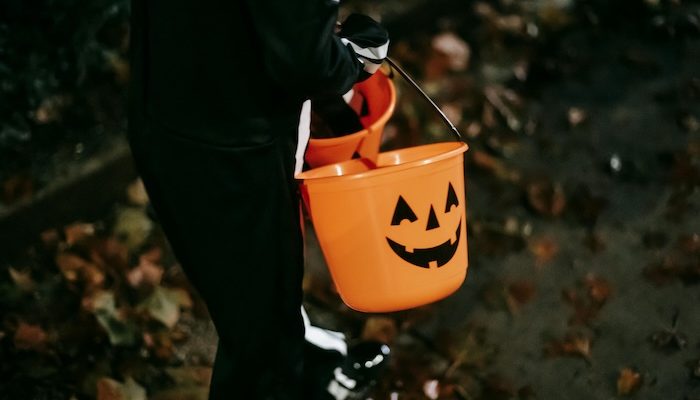 Kid with jack buckets on street